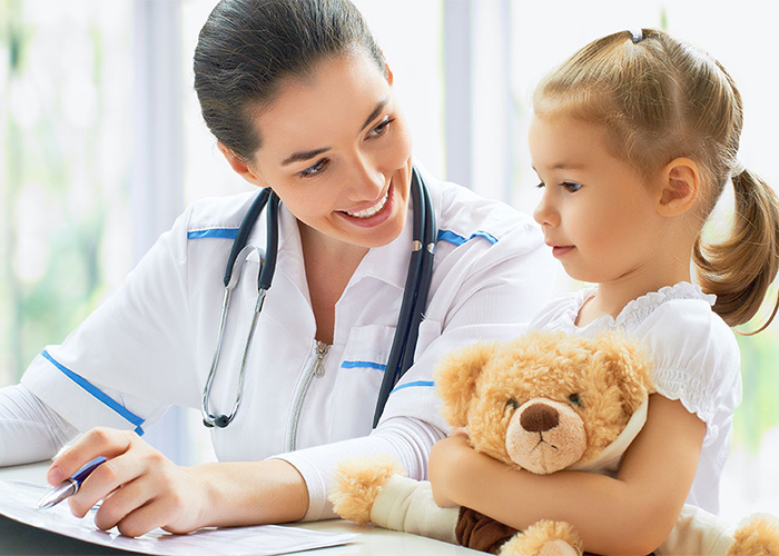 Doctor with child and teddy